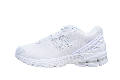 A white New Balance running shoe shown from the side profile against a solid white background.